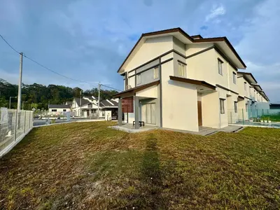 a house with a large yard in front of it at Rimbayu 81 in Kampung Bota Kiri