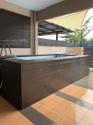 a large swimming pool in a house at Impiana Inn Seri Manjung in Seri Manjung