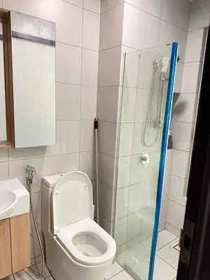 a bathroom with a toilet and a shower at Apartment in Batu Kawan in Batu Kawan