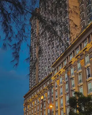 a tall building in front of a building at KF Homestay Premium Suite in Kampar