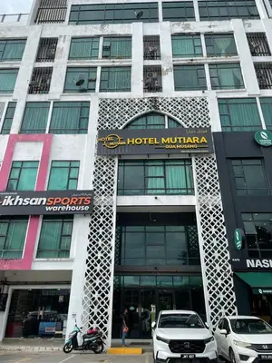 a building with a sign on the front of it at D'Anggun Studio in Gua Musang