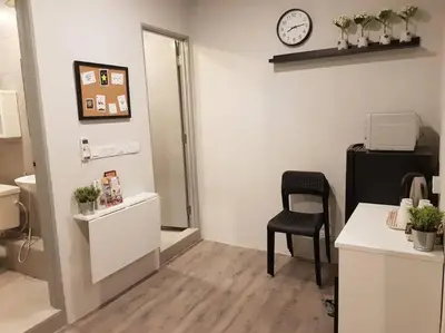 an office with a chair and a clock on the wall at Heritage Studio in UNESCO Zone near to StreetArt & Town 2 in George Town
