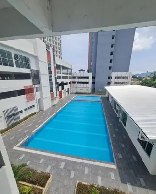 a swimming pool in the middle of a building at Kamilia Homestay Anderson Ipoh in Ipoh