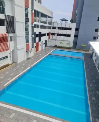 a large swimming pool on the side of a building at Kamilia Homestay Anderson Ipoh in Ipoh