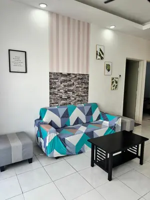 a living room with a couch and a table at AYAAN LAVISH HOMESTAY with FREE WiFi in Tanah Rata