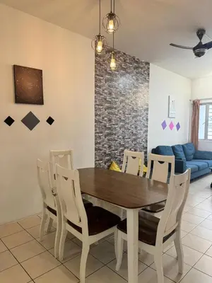 a dining room with a wooden table and chairs at AYAAN SERENE BUDGET HOMESTAY with FREE WiFi and Netflix in Tanah Rata