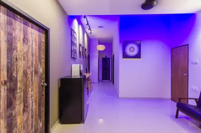 a hallway with purple lighting in a room with a hallway sidx sidx at Heaven 5BR Garden Inn by uBook in Butterworth