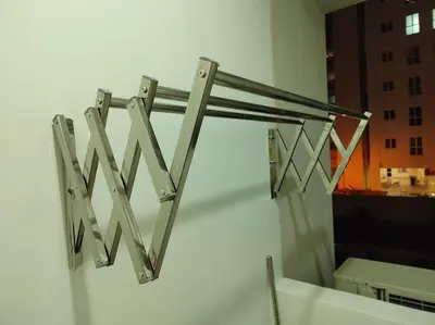 a metal towel rack on a wall with a mirror at Purrfect Nook 1BR Georgetown Straits Garden \u4e00\u623f\u4e00\u5385\u5f0f in Jelutong