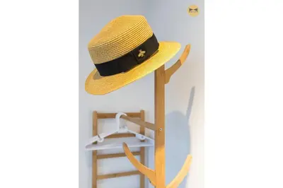 a straw hat sitting on a stand next to a shelf at Seaview Sunrise 1BR at Tropicana 218 at Central Location & Food Hunt Friendly in George Town