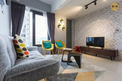 a living room with a couch and a tv at Seaview Sunrise 1BR at Tropicana 218 at Central Location & Food Hunt Friendly in George Town