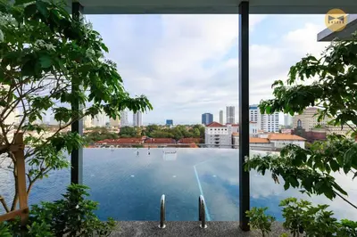 a view of a swimming pool from a building at Seaview Sunrise 1BR at Tropicana 218 at Central Location & Food Hunt Friendly in George Town