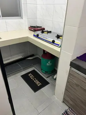 a room with a table with a tool on it at Homestay Cactus Apparment in Brinchang