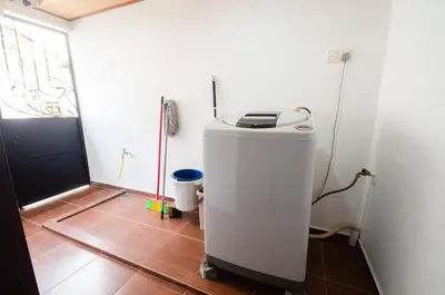 a small room with a heater in a room at Bukit Mertajam Double Storey Bungalow 15pax BBQ KTV in Bukit Mertajam