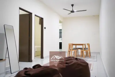 a dining room with a table and a chair at HAZZ Homestay Kulim IV in Kulim