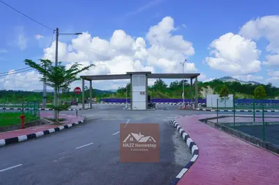 a gas station with a sign in the middle of the road at HAZZ Homestay Kulim IV in Kulim