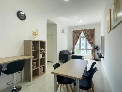 a living room with a dining room table and chairs at Ipoh Town Centre The Anderson For 5pax in Ipoh