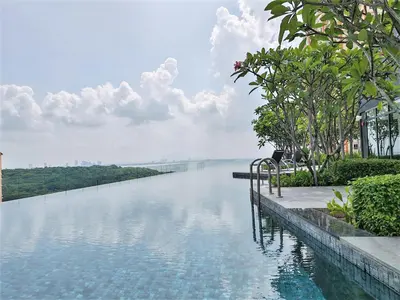 a view of a river with trees and clouds in the sky at SoftGrey 2 Rooms Apartment, 4 plus 2 Pax at Urban Suites in Jelutong