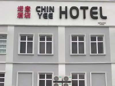 a building with a sign on the side of it at Chin Yee Hotel in Teluk Intan