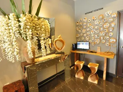 a dressing room with a table and a mirror at Le Metrotel in Ipoh