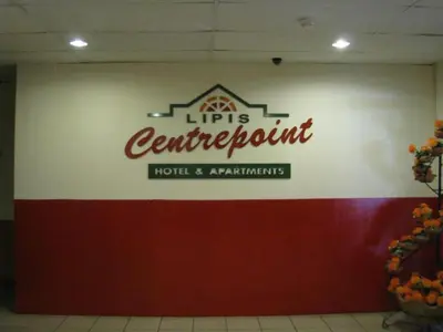 a sign on a wall in a room at Hotel Centrepoint (Self Check In After 5PM) in Kuala Lipis