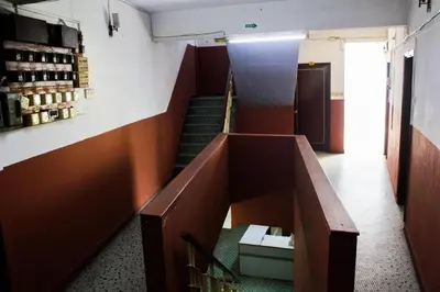 a stairway in a building with a room with wine bottles at Sun Golden Inn in Ipoh