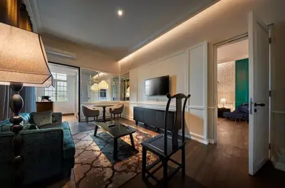 a living room with a couch and a table at The Edison George Town in George Town