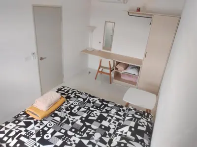 a small bedroom with a bed and a desk at IFS SoHo Basic Homestay Entire Home in Seri Iskandar