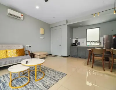 a living room with a couch and a table at 3 Bedroom Izz Homestay Casa kayangan in Ipoh