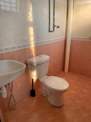 a bathroom with a toilet and a sink at D Ocean Homestay in Seri Manjung