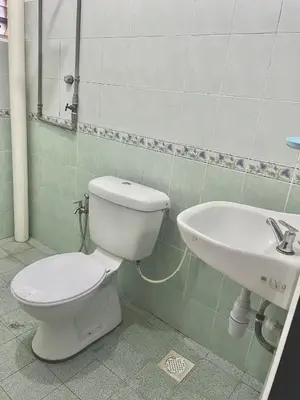 a bathroom with a toilet and a sink at D Ocean Homestay in Seri Manjung