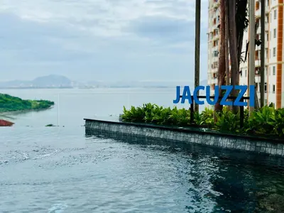 a sign for a hotel next to a body of water at Luxury Apartment Sea&City View Georgetown 14 pax in Jelutong