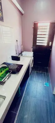 a bathroom with a sink and a shower at Homestay Manjung HZ in Sitiawan