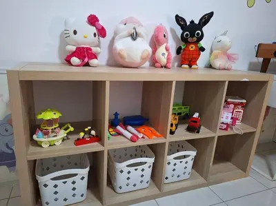 a shelf filled with stuffed animals and toys at Anderson Zara Homestay in Ipoh