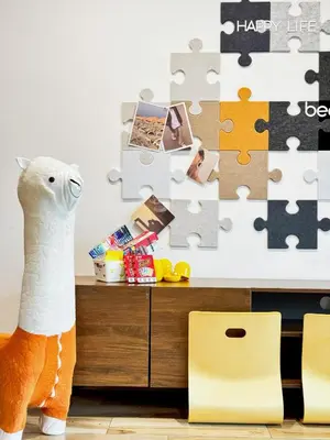 a toy llama standing next to a jigsaw puzzle at i Homes Villa 2 at Ipoh Town 16 Guest in Ipoh