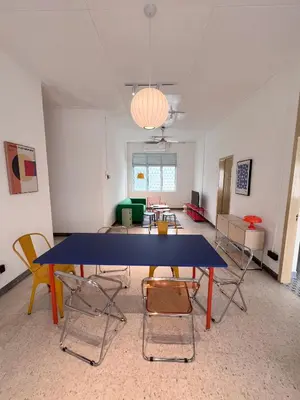 a large room with a blue table and chairs at Canning 48 in Ipoh