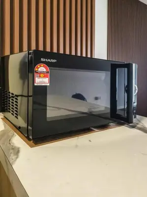 a microwave oven sitting on top of a counter at Sunrise Serenity at Palas Horizon Residence in Brinchang