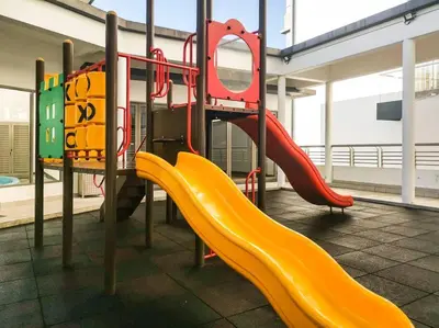 a playground with a slide in a building at Sunrise Serenity at Palas Horizon Residence in Brinchang