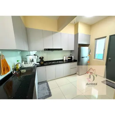 a kitchen with white cabinets and a stainless steel refrigerator at D' Alyssa Homestay Perda in Bukit Mertajam