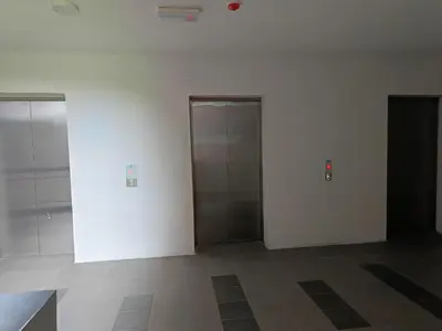 an empty room with two elevators in a building at Dream Anderson Condo in Ipoh