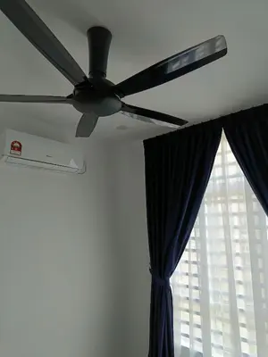 a ceiling fan in a room with a window at Dream Anderson Condo in Ipoh