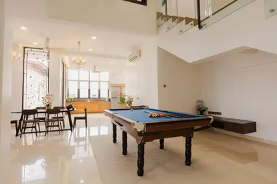 a room with a pool table and a dining room at Gelugor 2Storey Big Bungalow 23pax with BBQ Snooker in Gelugor