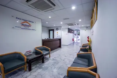 a waiting room with chairs and a table in a hospital at Bahagia Stay Georgetown in George Town