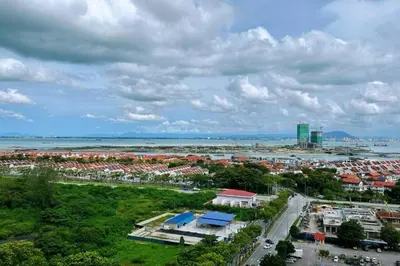 an aerial view of a city and the ocean at 118 Island Plaza ComFy Seaview Suite in Tanjong Tokong