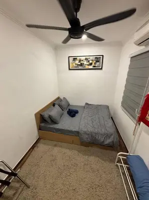 a bedroom with a bed with a ceiling fan at Bagan Serai Simpang Empat Parit Buntar Perak by 3SIBS in Bagan Serai