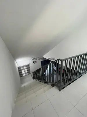 a staircase in a building with a white ceiling at Damai Centaurea Homestay Utp Uitm Seri Iskandar Perak in Seri Iskandar