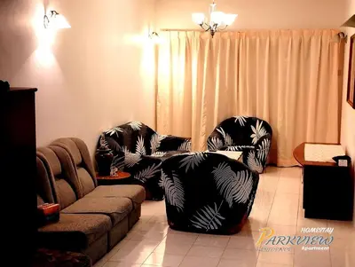 a living room with two chairs and a couch at RF Parkview Residence Homestay in Tanah Rata