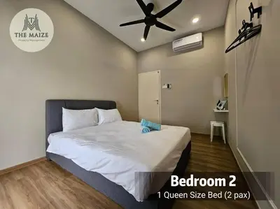 a bedroom with a bed with a ceiling fan at The Cove Hillside Residence - Grandiose Oasis in Ipoh