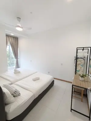 a white room with a bed and a table at Dream 6 Emerald avenue in Cameron Highlands