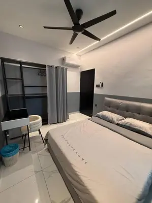 a bedroom with a bed and a ceiling fan at Live Like Your Home, Alma Bukit Mertajam in Bukit Mertajam