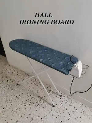 a ironing board sitting in a corner of a room at Bergstein Taiping in Taiping